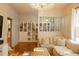Bright living room with hardwood floors, a crystal chandelier, and decorative shelving at 203 Weiters St, Walterboro, SC 29488