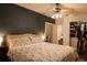 Comfortable main bedroom with a queen-size bed, ceiling fan, and closet at 203 Weiters St, Walterboro, SC 29488