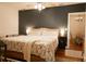 Comfortable main bedroom with a queen-size bed, soft lighting, and a view into dining room at 203 Weiters St, Walterboro, SC 29488