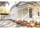 Charming white home with brick stairs, a covered porch, and fresh paint at 203 Weiters St, Walterboro, SC 29488