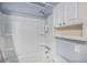 Bathroom features a white tub with shower, a shower head, shelves and cabinets at 2045 Rondo St # B, Charleston, SC 29414