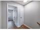 Hallway with wood flooring and an open doorway looking into the room at 2045 Rondo St # B, Charleston, SC 29414
