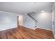 Comfortable living area featuring hardwood floors, neutral paint, and a staircase at 2045 Rondo St # B, Charleston, SC 29414