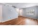 Inviting living space with hardwood floors, neutral tones, and staircase access at 2045 Rondo St # B, Charleston, SC 29414