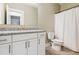 Clean bathroom with granite counters, tile floor, shower with curtain, and modern fixtures at 206 Almond Ct, Summerville, SC 29483