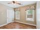Bedroom with hardwood floors, ceiling fan, and windows with custom valances at 206 Almond Ct, Summerville, SC 29483
