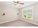 Bedroom with carpet, ceiling fan, modern sconce lighting, and bright windows at 206 Almond Ct, Summerville, SC 29483