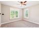Bedroom with carpet, ceiling fan, modern sconce lighting, and bright windows at 206 Almond Ct, Summerville, SC 29483