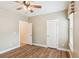 Bedroom with hardwood floors, ceiling fan, open closet, and view to the hall at 206 Almond Ct, Summerville, SC 29483