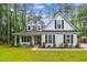Charming white two-story home with a landscaped front yard and black shutters at 206 Almond Ct, Summerville, SC 29483