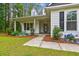 Inviting front entrance with a covered porch, beautiful hydrangeas, and manicured landscaping at 206 Almond Ct, Summerville, SC 29483