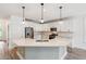 Well-lit kitchen featuring white cabinets, stainless steel appliances, and quartz countertops at 206 Almond Ct, Summerville, SC 29483
