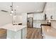 Modern kitchen featuring stainless steel appliances, a center island, and white cabinets at 206 Almond Ct, Summerville, SC 29483