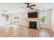 Spacious living room with fireplace, hardwood floors, lots of light, and access to the patio at 206 Almond Ct, Summerville, SC 29483
