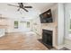 Open living room with hardwood floors, fireplace, lots of light, and view of the kitchen at 206 Almond Ct, Summerville, SC 29483