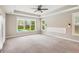 Main bedroom features a ceiling fan, recessed lights, carpeted floor, and a large window at 206 Almond Ct, Summerville, SC 29483