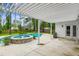 Relaxing outdoor patio area featuring a beautiful pool, spa, pergola, and a convenient door to the house at 206 Almond Ct, Summerville, SC 29483