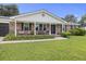 Attractive brick home featuring a covered front porch and well-kept landscaping at 212 Columbia Dr, Ladson, SC 29456