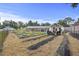 Backyard features an expansive garden with neatly planted rows, straw ground cover, and a storage shed at 212 Columbia Dr, Ladson, SC 29456