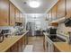 Galley kitchen with oak cabinets, stainless steel appliances, and a breakfast nook at 212 Columbia Dr, Ladson, SC 29456