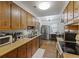 Functional kitchen featuring wood cabinets, stainless steel appliances, and ample counter space at 212 Columbia Dr, Ladson, SC 29456