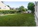 Spacious backyard with lush green grass and mature landscaping at 216 Foxbank Plantation Blvd, Moncks Corner, SC 29461