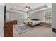 Spacious bedroom featuring a tray ceiling, neutral colors, and bright light at 216 Foxbank Plantation Blvd, Moncks Corner, SC 29461