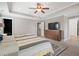 Large bedroom featuring a tray ceiling, neutral colors, and carpeted floors at 216 Foxbank Plantation Blvd, Moncks Corner, SC 29461