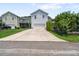 Exterior of home features a driveway leading up to the two car garage at 216 Foxbank Plantation Blvd, Moncks Corner, SC 29461