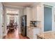 Kitchen showcasing stainless steel refrigerator and view into dining room with wood floors at 216 Foxbank Plantation Blvd, Moncks Corner, SC 29461