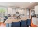Bright kitchen featuring an island with seating, stainless steel appliances, and ample counter space at 216 Foxbank Plantation Blvd, Moncks Corner, SC 29461