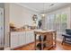 Charming kitchen with island, wood countertop, and natural light through the window at 216 Foxbank Plantation Blvd, Moncks Corner, SC 29461