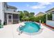 Backyard pool features a basketball hoop, a grey concrete surround, and a pool bar with an awning at 216 Foxbank Plantation Blvd, Moncks Corner, SC 29461