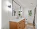 Bathroom featuring a vanity with a marble countertop, a mirror, and natural light at 217 Quaker Rd, Saint George, SC 29477
