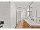 Bathroom showcasing a vanity with a sink, a mirror, and marble tile at 217 Quaker Rd, Saint George, SC 29477