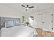 Cozy bedroom featuring a ceiling fan, comfortable bed, and bright natural light at 217 Quaker Rd, Saint George, SC 29477
