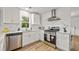 Well-equipped kitchen featuring stainless steel appliances, ample counter space, and bright, natural light at 217 Quaker Rd, Saint George, SC 29477