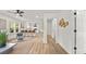 Bright and airy living room with modern finishes and an open layout, showcasing the seamless flow to the kitchen at 217 Quaker Rd, Saint George, SC 29477