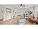 Well-lit living room features modern décor, open space, and beautiful flooring that leads to other rooms at 217 Quaker Rd, Saint George, SC 29477