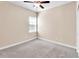 Bedroom featuring neutral walls, carpet, a window and a ceiling fan at 224 Sugarhouse Ct, Moncks Corner, SC 29461