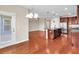 Open kitchen layout with island, stainless appliances, granite countertops, and hardwood flooring at 224 Sugarhouse Ct, Moncks Corner, SC 29461