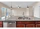 Modern kitchen featuring granite counters, stainless steel dishwasher, and a dual bowl sink at 224 Sugarhouse Ct, Moncks Corner, SC 29461