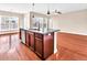 Modern kitchen island featuring granite countertops, stainless steel dishwasher, and wooden floors at 224 Sugarhouse Ct, Moncks Corner, SC 29461