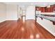 Open living space flowing into kitchen with stainless steel appliances and granite countertops at 224 Sugarhouse Ct, Moncks Corner, SC 29461