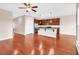 Open concept living and kitchen area with hardwood floors and stainless steel appliances at 224 Sugarhouse Ct, Moncks Corner, SC 29461