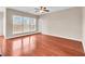 Bright living room with hardwood floors, large windows, and neutral walls at 224 Sugarhouse Ct, Moncks Corner, SC 29461
