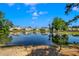 A pond in the neighborhood features a view of the surrounding houses on a sunny day at 224 Sugarhouse Ct, Moncks Corner, SC 29461