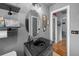 Stylish bathroom with sleek black sink, granite counters, oval mirror, and decorative wall art at 2651 Martha Dr, North Charleston, SC 29405