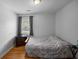 A bedroom featuring hardwood floors, a window, a dresser, and a twin-size bed at 2651 Martha Dr, North Charleston, SC 29405