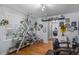 Bright living room featuring hardwood floors, built in shelving, and eclectic decor at 2651 Martha Dr, North Charleston, SC 29405